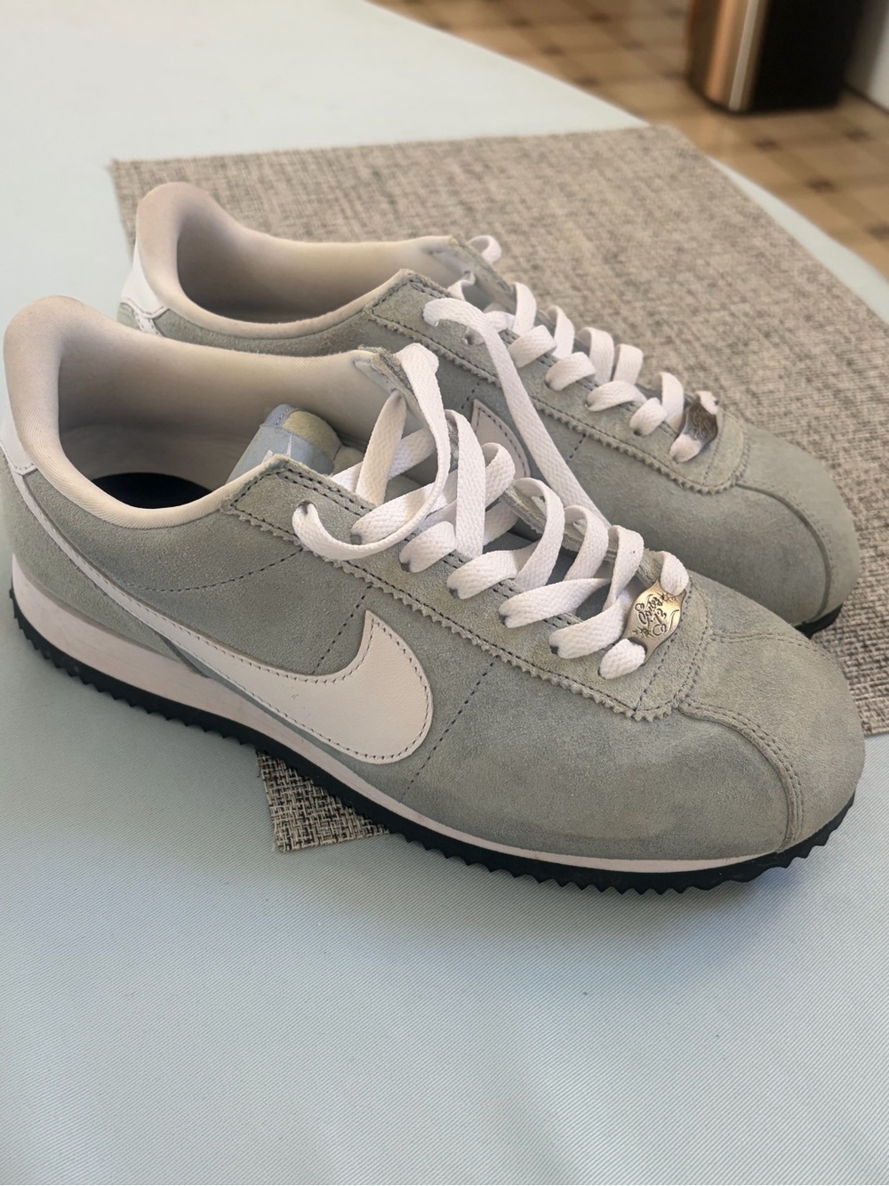 Nike Women's Suede Runner in Light Gray and White